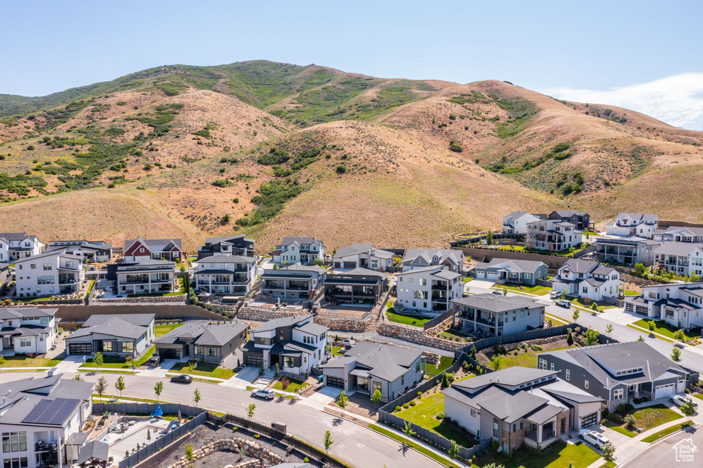 Aerial perspective of suburban area with a mountain backdrop