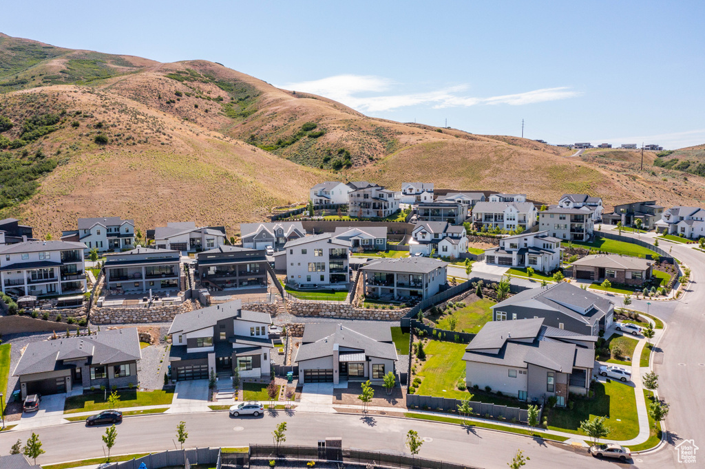 Aerial perspective of suburban area with a mountainous background