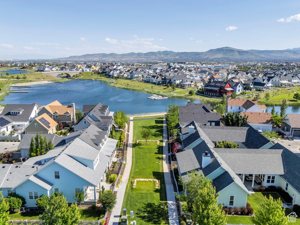 Aerial perspective of suburban area with a water and mountain view