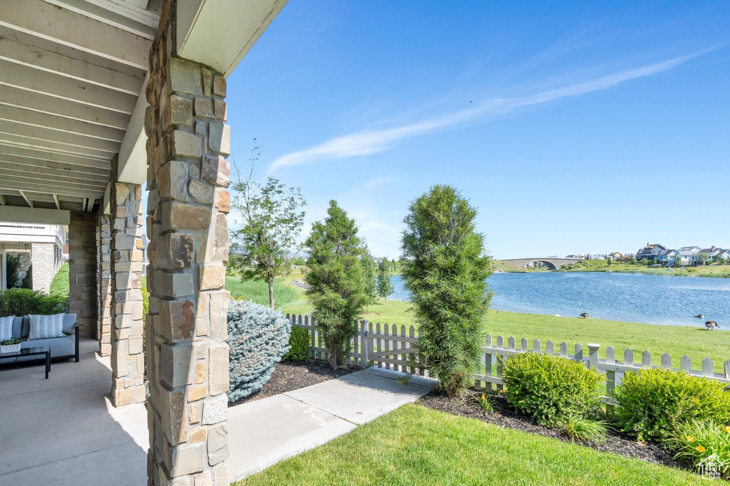 View of yard with a water view