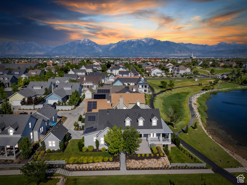 Aerial perspective of suburban area with a water and mountain view