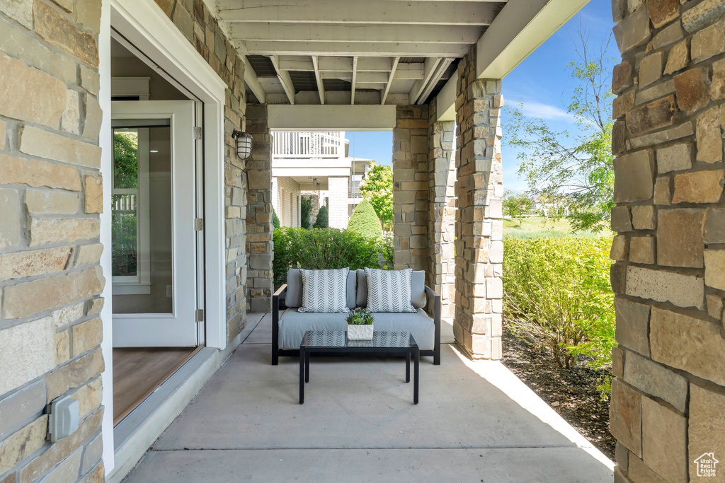 View of patio with an outdoor hangout area