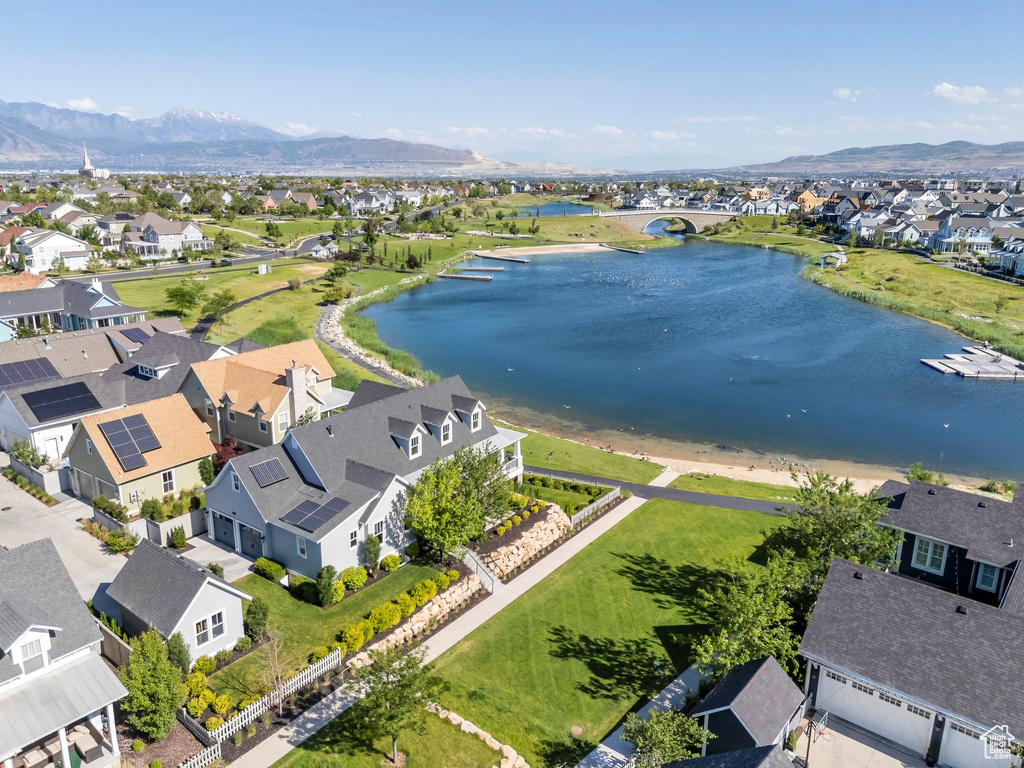Aerial view of residential area featuring a water and mountain view