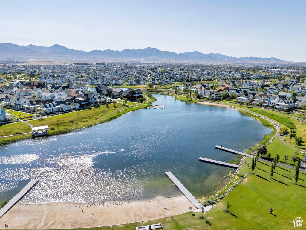 Aerial perspective of suburban area featuring a water and mountain view