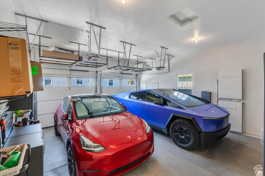 Garage featuring a garage door opener