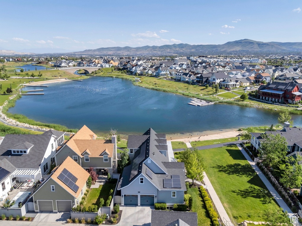Aerial perspective of suburban area with a water and mountain view