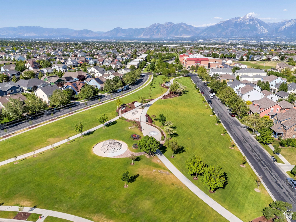 Aerial overview of property's location featuring nearby suburban area and mountains