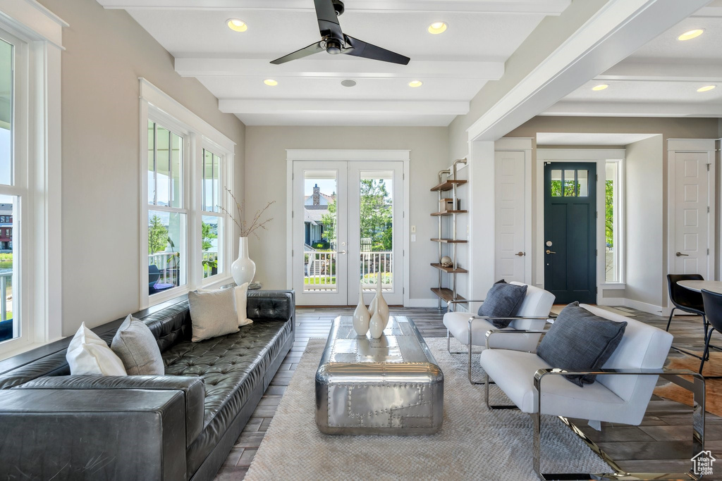 Living room featuring recessed lighting, baseboards, ceiling fan, beam ceiling, and wood finished floors