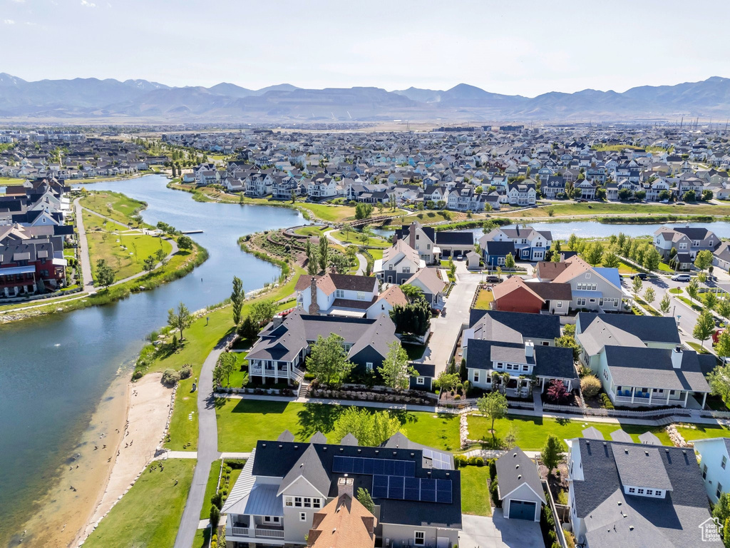 Aerial perspective of suburban area with a water and mountain view