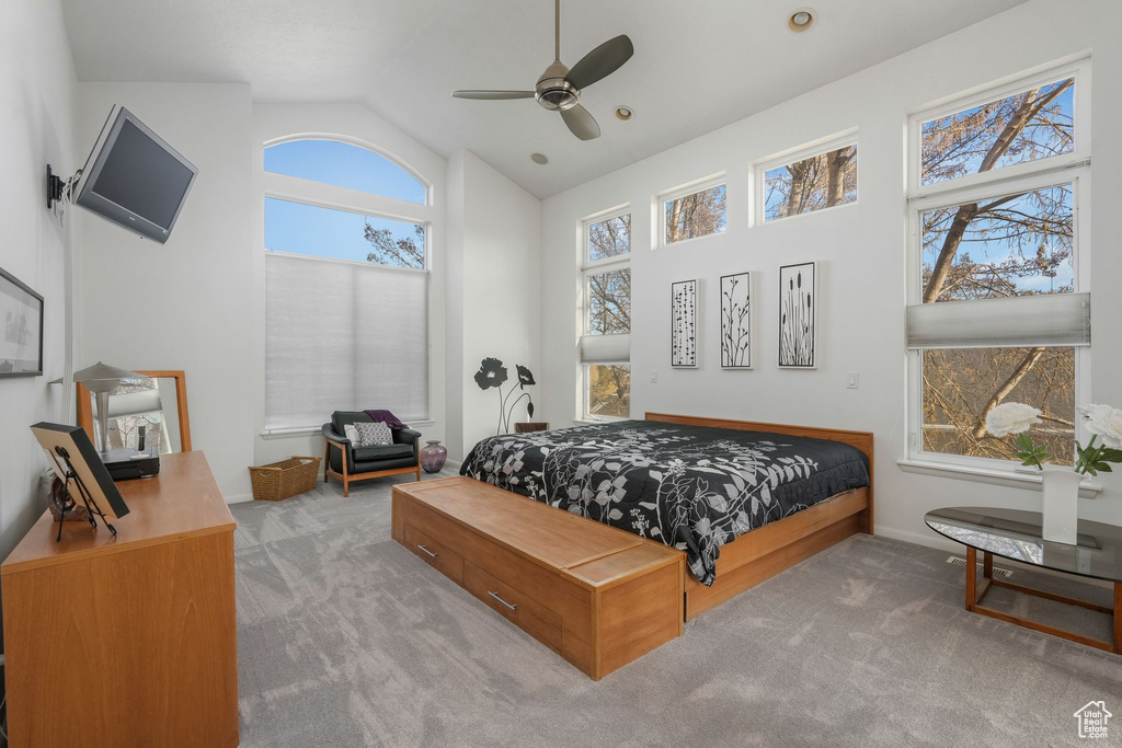 Bedroom featuring carpet floors, high vaulted ceiling, a ceiling fan, and baseboards
