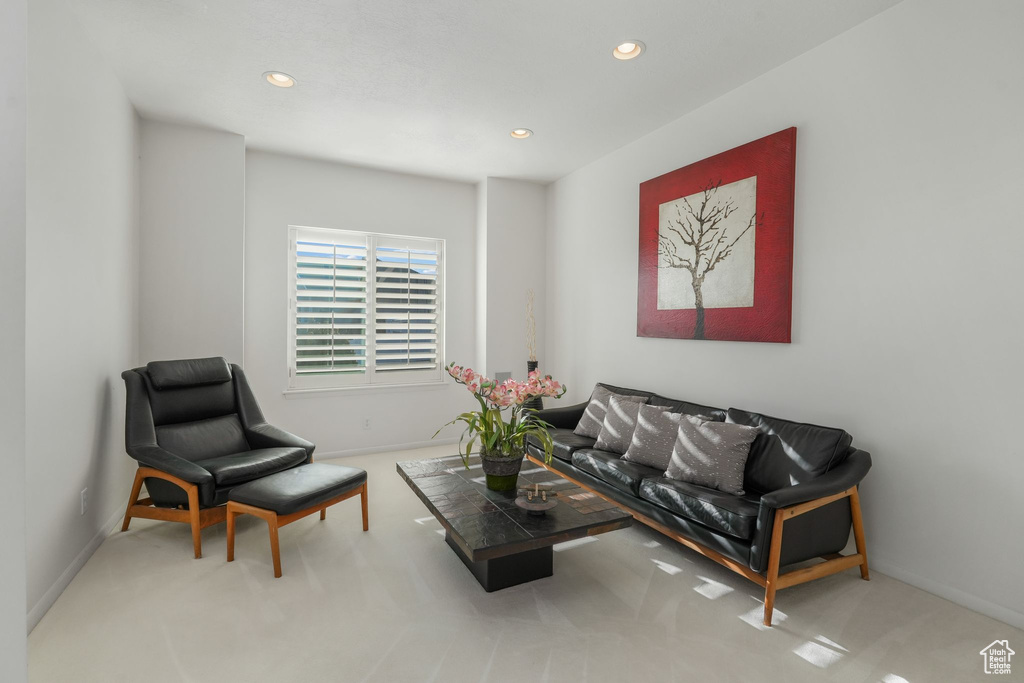 Living area featuring carpet, recessed lighting, and baseboards
