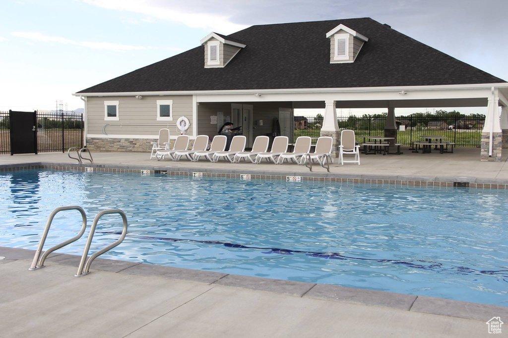 Community pool featuring a patio
