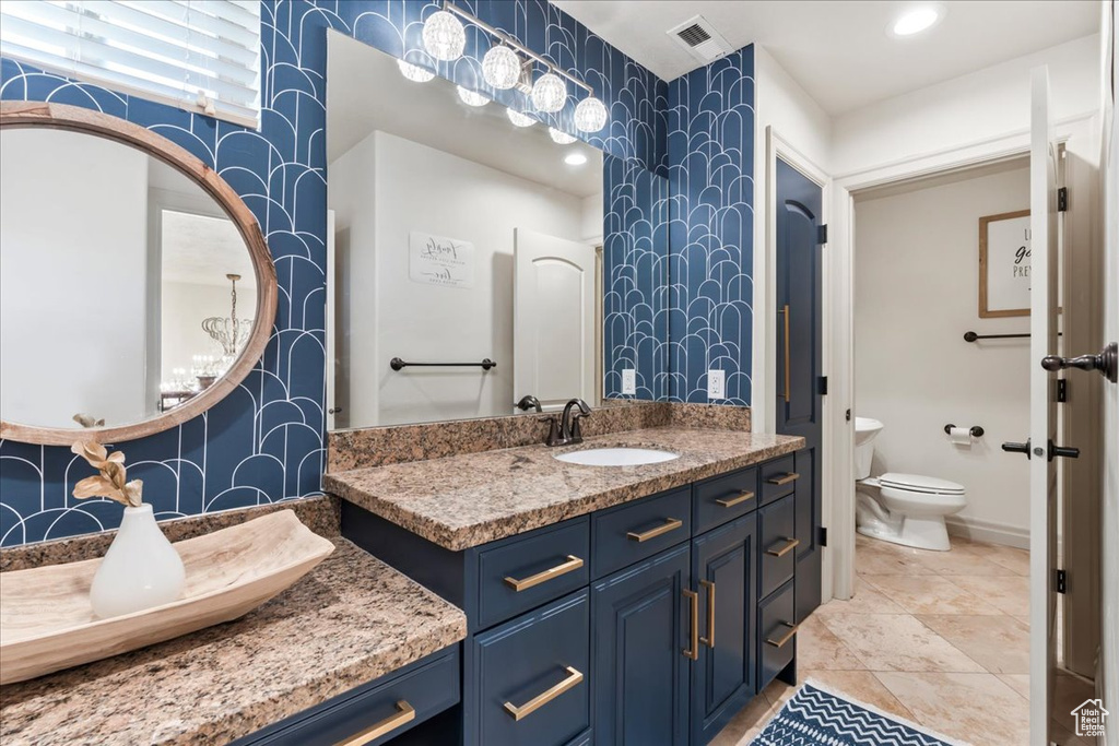 Bathroom with toilet and vanity