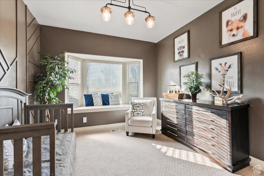 Carpeted bedroom featuring baseboards