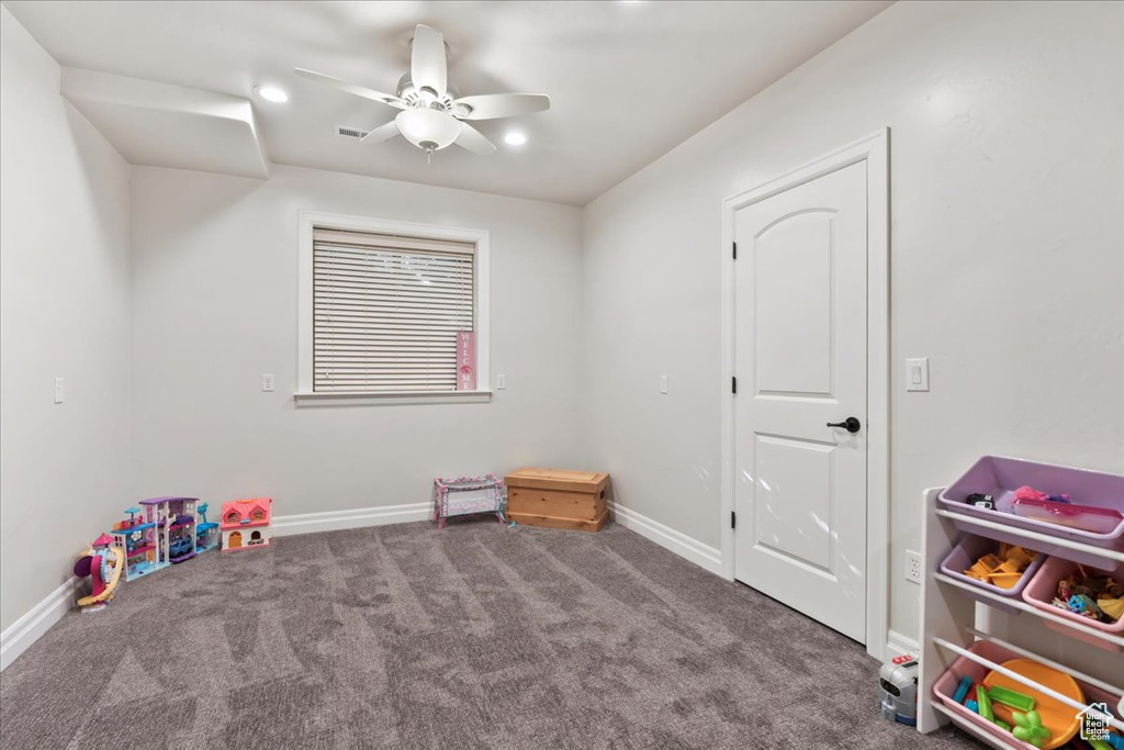 Recreation room with ceiling fan, carpet floors, baseboards, and recessed lighting