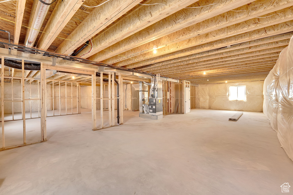 Below grade area featuring heating unit