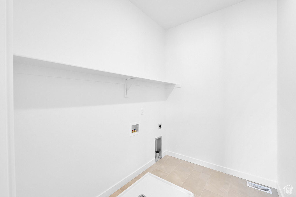 Washroom featuring washer hookup, electric dryer hookup, and baseboards