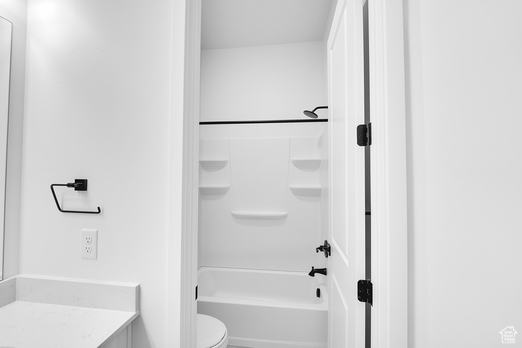 Full bathroom with toilet, shower / bath combination, and vanity
