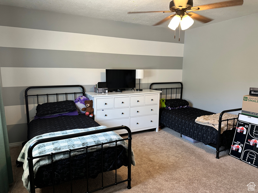 Bedroom featuring carpet flooring and a ceiling fan