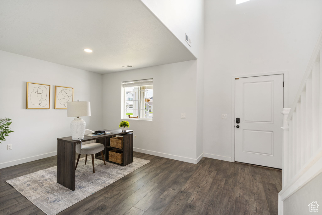 Office with dark wood-style floors, baseboards, and recessed lighting