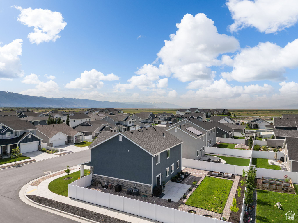 Aerial view of residential area featuring a mountainous background
