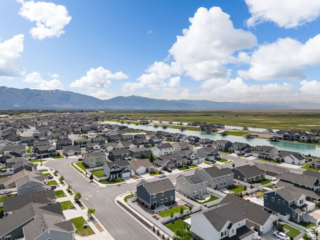 Aerial perspective of suburban area with a water and mountain view