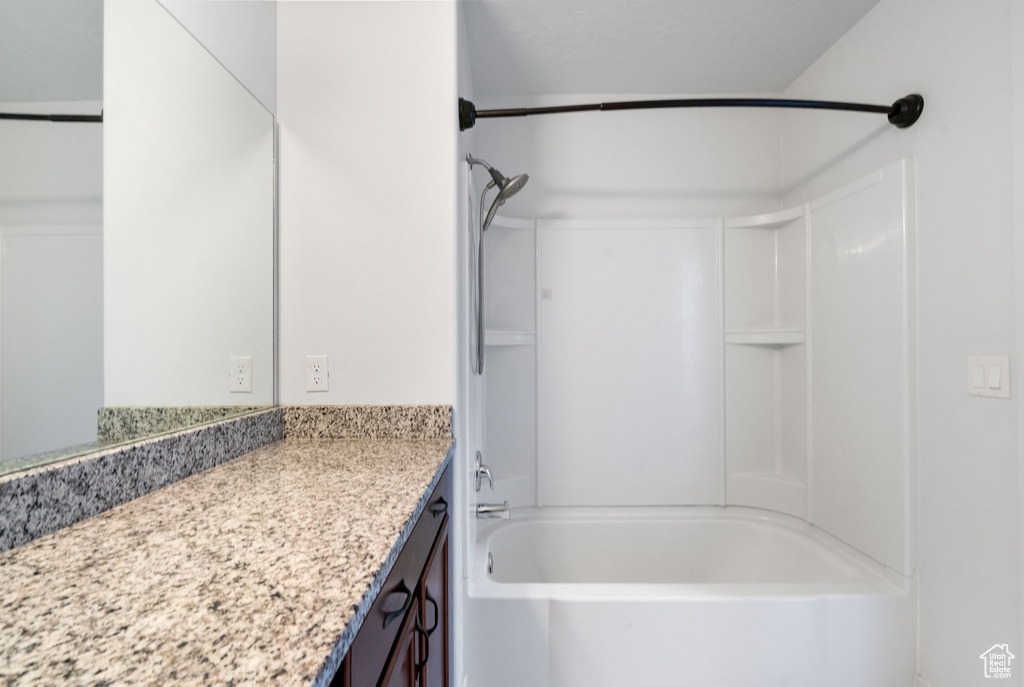 Bathroom featuring vanity and bathtub / shower combination