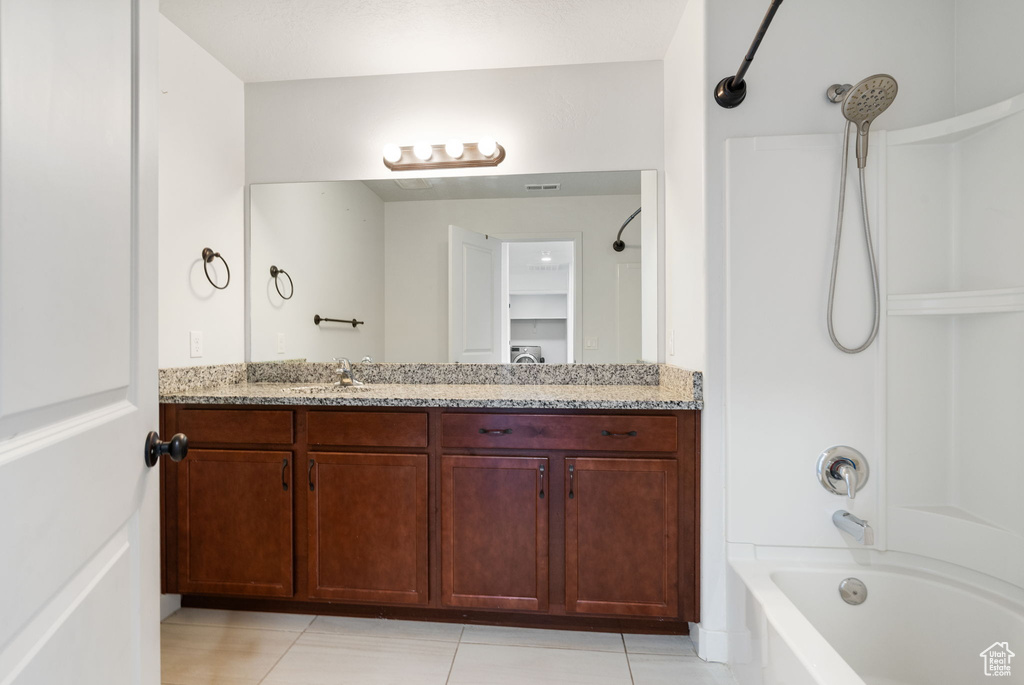 Full bath with vanity, shower / bathtub combination, and tile patterned floors