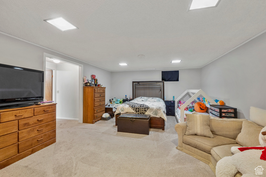 Bedroom with carpet floors and ornamental molding