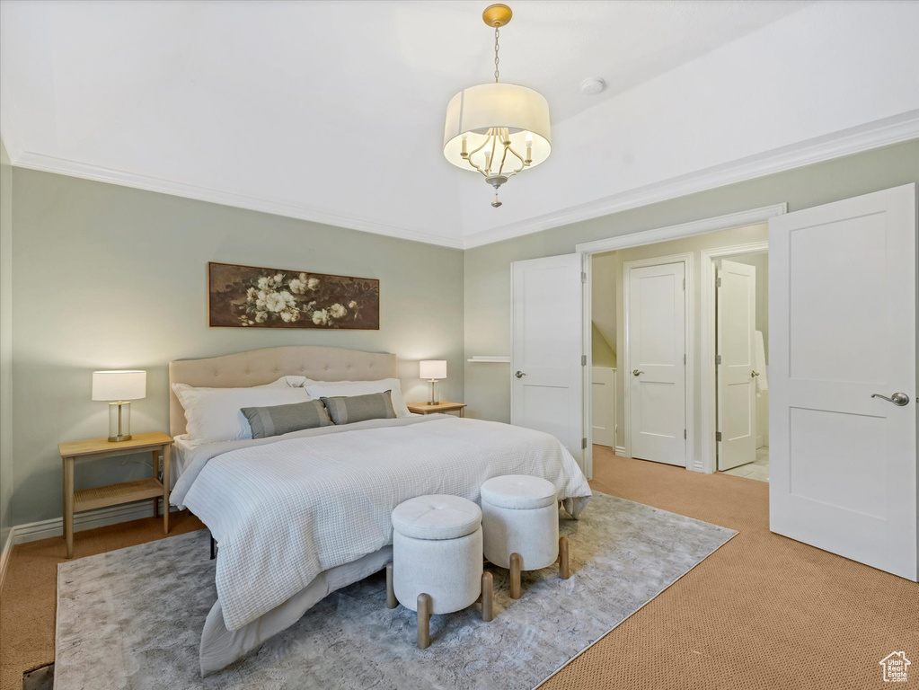 Bedroom featuring light carpet and ornamental molding
