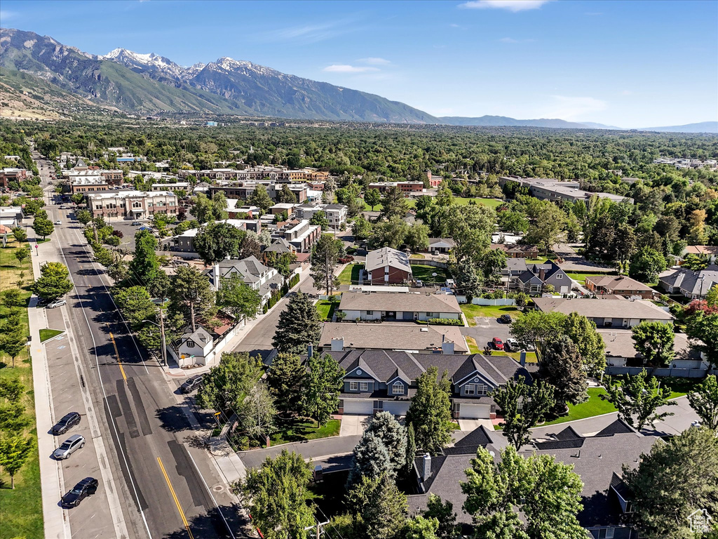 Aerial perspective of suburban area with a mountain backdrop