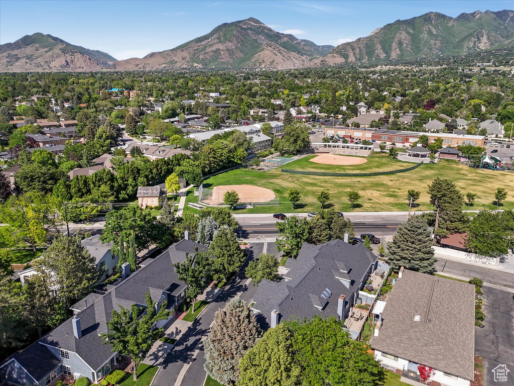 View of property location featuring nearby suburban area and a mountain backdrop