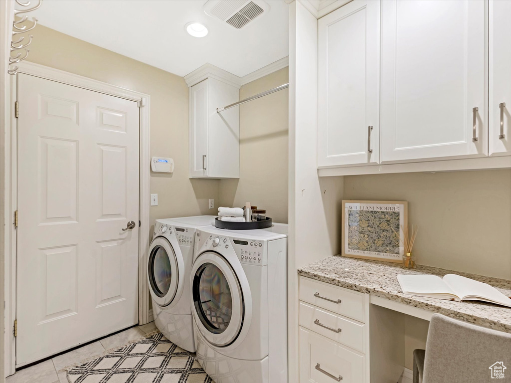 Washroom with washer and clothes dryer, cabinet space, light tile patterned floors, a desk, and recessed lighting