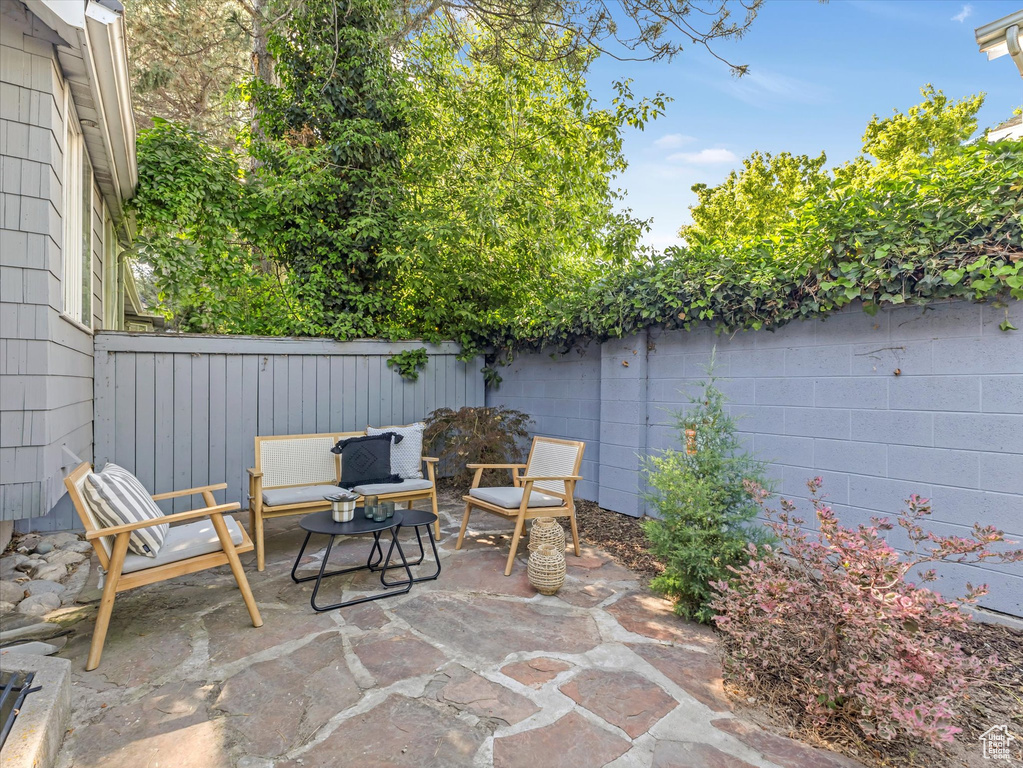 Fenced backyard featuring a patio
