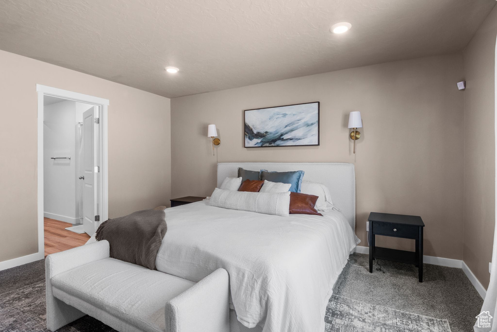 Carpeted bedroom featuring baseboards and recessed lighting