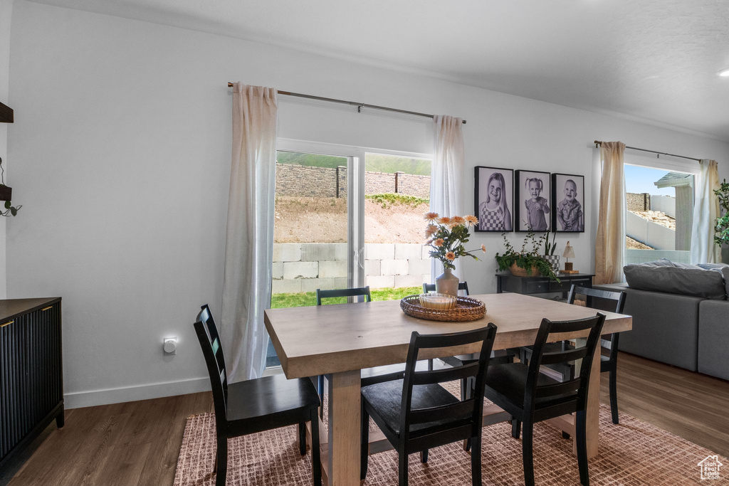 Dining area with wood finished floors and baseboards