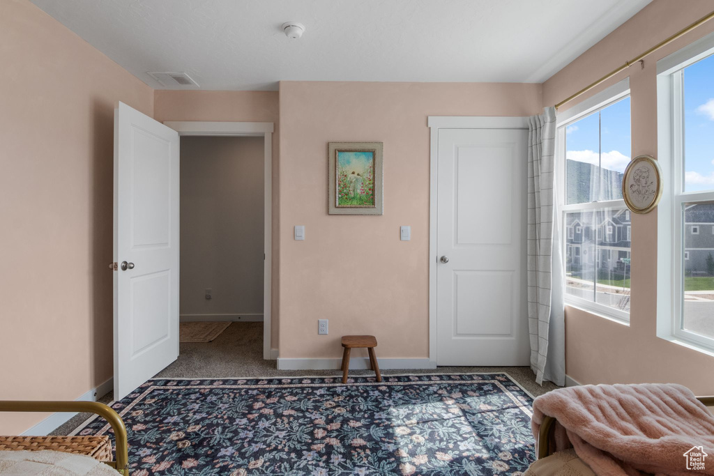 Bedroom with baseboards and carpet flooring