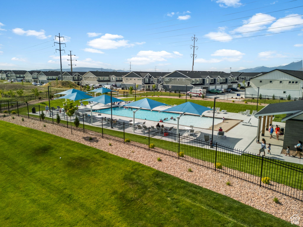 View of pool with a residential view