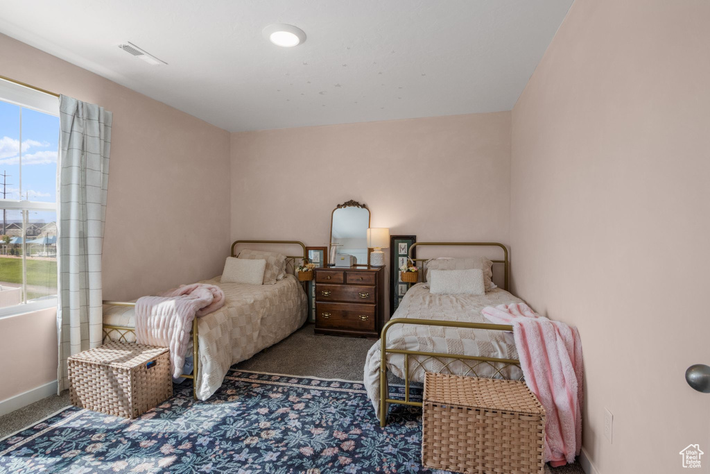 Carpeted bedroom with baseboards