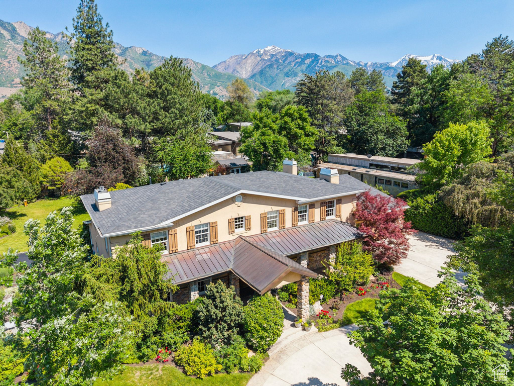 View of subject property with a mountain backdrop