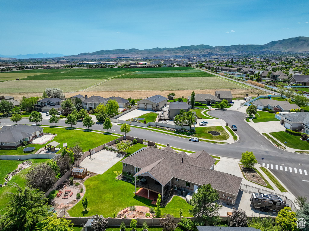 Aerial perspective of suburban area featuring a mountain backdrop