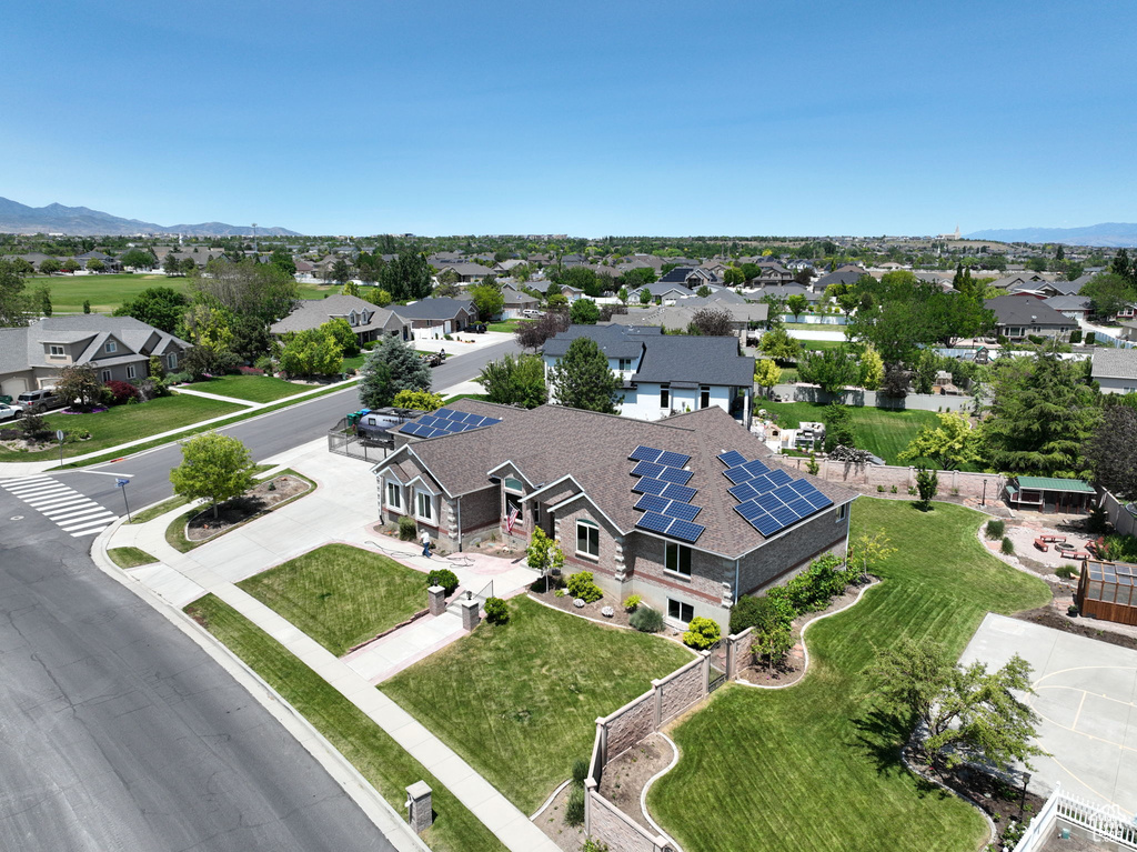Aerial view of residential area featuring a mountain backdrop