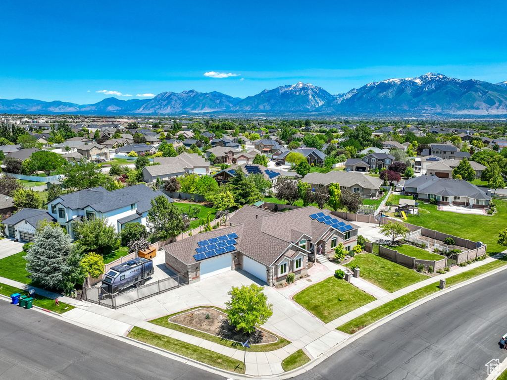 Aerial view of residential area featuring a mountain backdrop