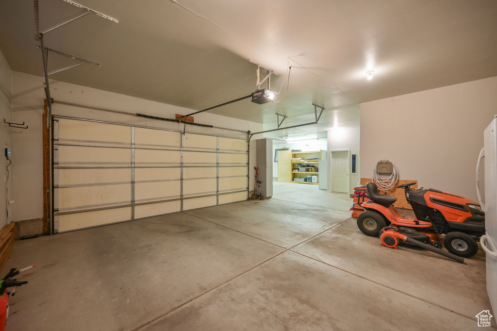 Garage featuring a garage door opener