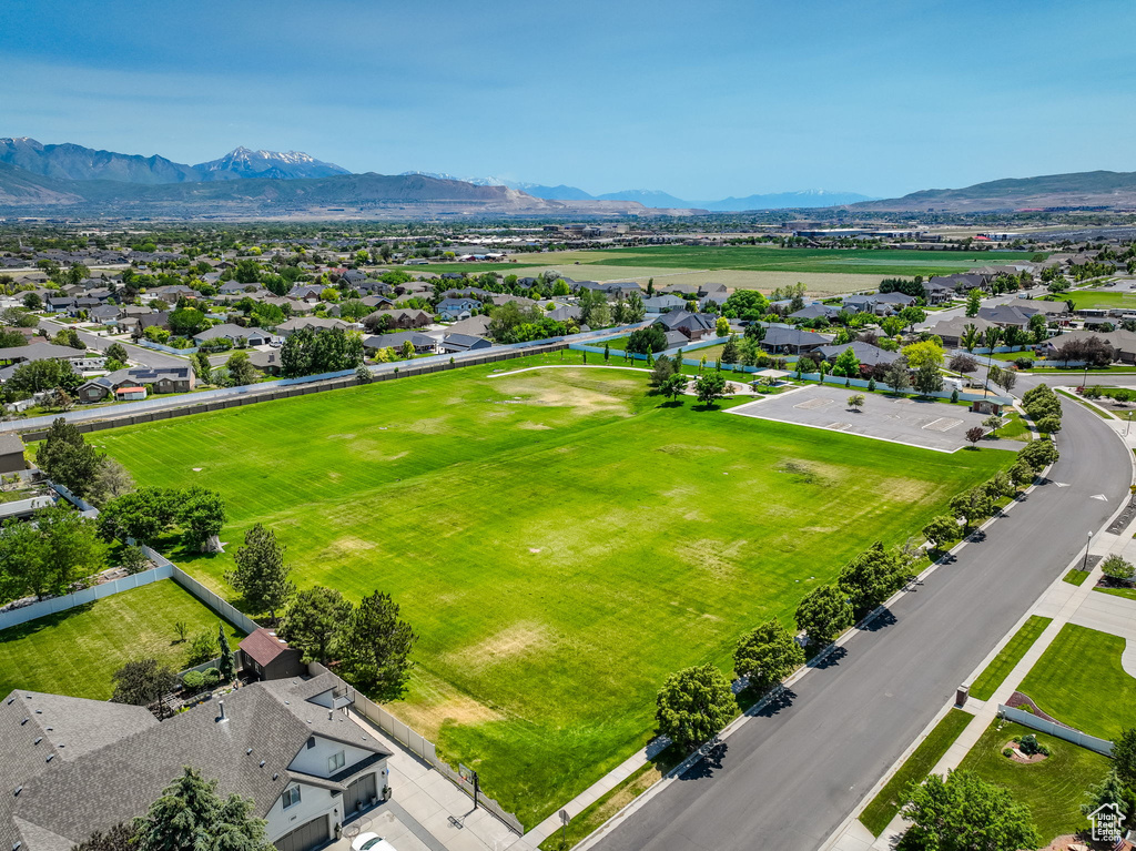 Aerial view of residential area featuring a mountainous background