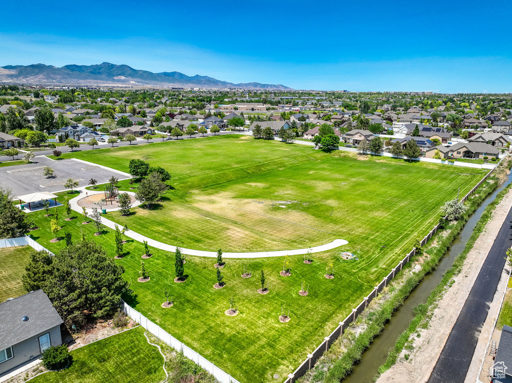 Aerial perspective of suburban area featuring a mountainous background