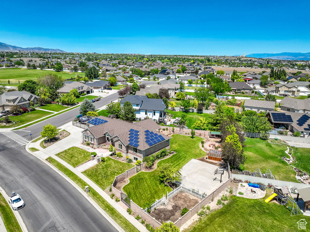 Aerial view of residential area featuring a mountainous background