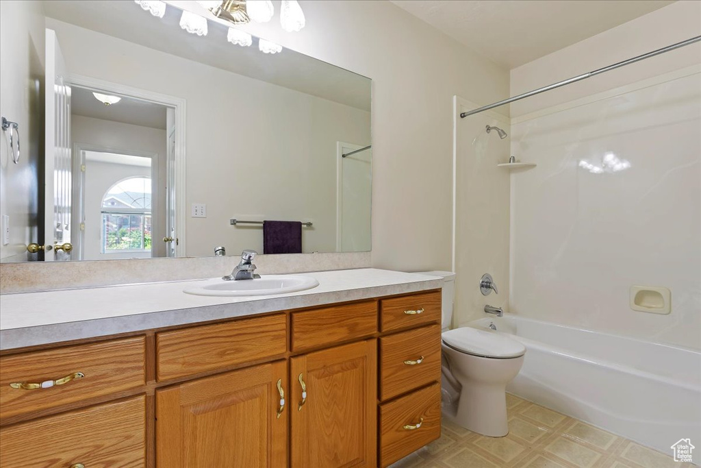 Full bath with toilet, shower / bath combination, vanity, and tile patterned floors