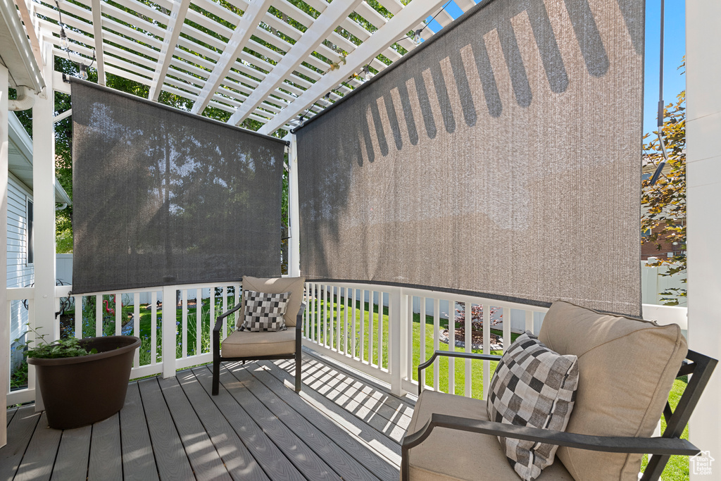 Wooden deck featuring a pergola
