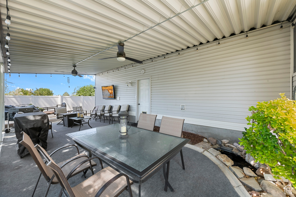 View of patio / terrace with outdoor dining space, a ceiling fan, and an outdoor hangout area